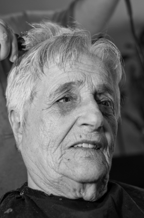 Old woman having a hair cutの写真素材