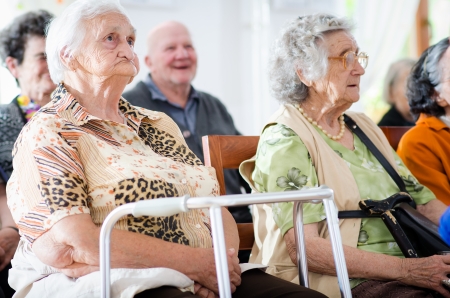 elderly man and woman sitting の写真素材