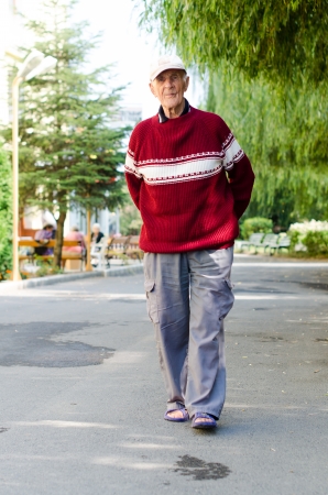 90's senior man walking outdoorsの写真素材