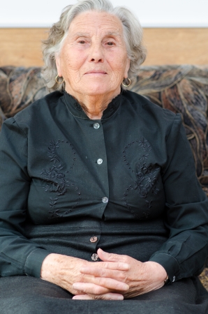 Senior woman relaxing in bedの写真素材