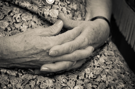 old woman's hands joined togetherの写真素材