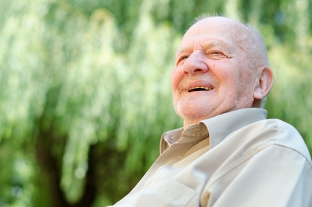 Closeup profile on a smiling old manの写真素材