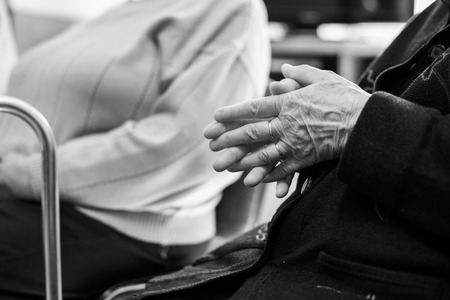Closeup of an old woman's hands joinedの写真素材