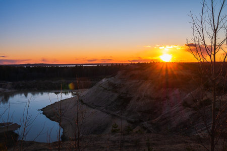 Sand mountains with small coniferous trees. The lake in the middle of the mountains. Beautiful...