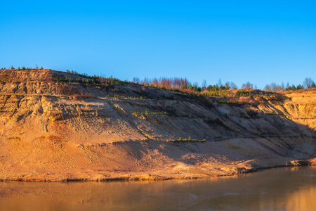 A small river flowing between two mountains. The creek from which the river begins. Sand and stone...