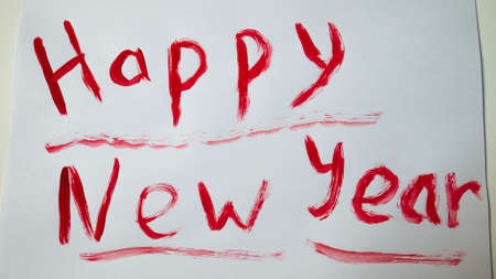 Written with brush and paint letters on a white paper. Photo of bright colorful handwritten inscriptions. Inscription brush months of the year.の写真素材