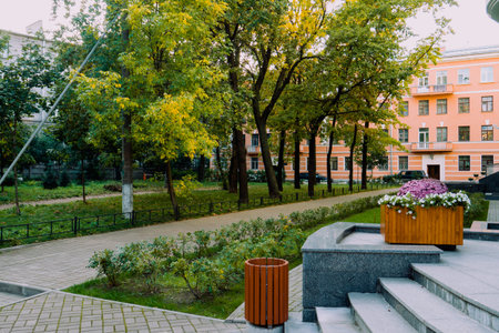 Green is a beautiful well-groomed garden in front of the house. A place with plants in front of the building.の写真素材