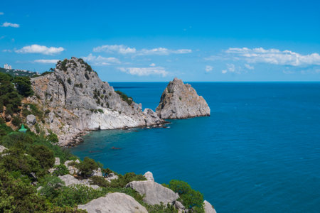 A large rock sticking out above the sea. a sharp rock.の写真素材