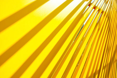 Yellow metal fence with diagonal stripes. Abstract background and texture for design.の素材