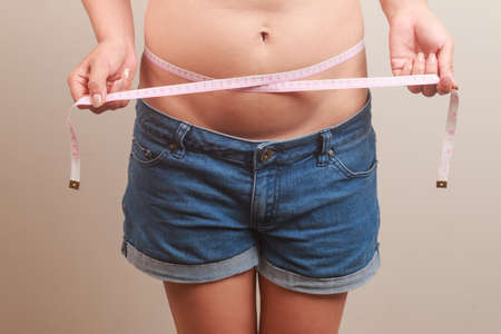 girl with a cellulitis on a stomachの写真素材