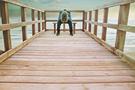 A lonely man on the beachの写真素材