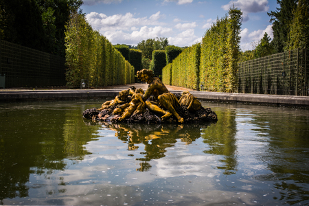 Golden Statue Reflection in Green Versailles Gardenのeditorial素材
