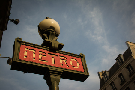 Afternoon Parisian Metro Sign with Red Metal and Skyのeditorial素材