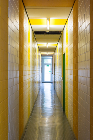 Yellow White Stripes Hallway Narrow Architecture Painted Exit Glass Door Interiorの写真素材