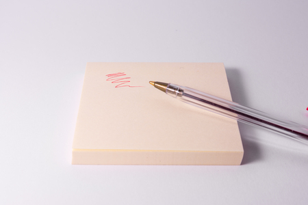 Red Pen Ink Writing Sticky Note Notepad Reminder Scribble White Backgroundの写真素材