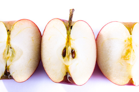 Bright Red Fresh Fruit Apple Slices Quarters Pieces Healthy Isolated White Background Foodの写真素材