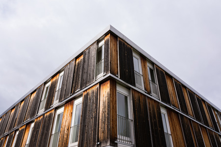 Wood Log Panel Building Rough Brown Shades Burnt Look Exterior Architecture Water Reflection Landscape Outsideの写真素材