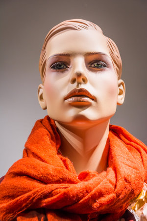 Female Mannequin Doll Puppet Display Window Fashion Clothes Scarf Red Closeup Portrait Shop Store Shoppingの写真素材