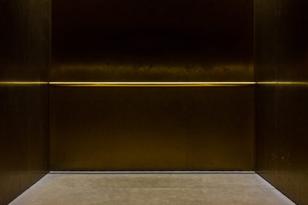 Empty Fancy Elevator Carriage Metal Pole Inside Metal Box Interior Closed Elegant Gold Bronze...