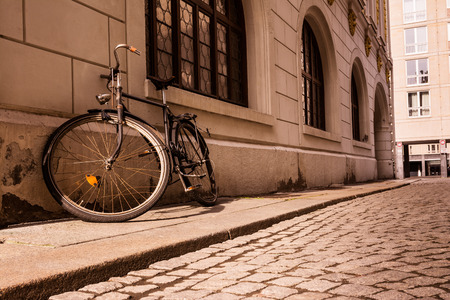 Old Vintage Sepia Bicycle Sidewalk Wall Stone Outdoors Ruined Worn Out Frame Street Cobblestoneの写真素材