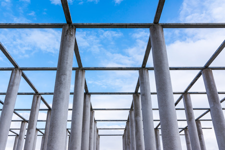 Cement Columns Chair Rough Texture Perspective Overhead Grid Geometric Pattern Design Outdoor Park Public Upright Minimal Bright Stoneの写真素材