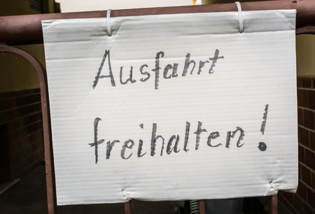 Ausfahrt Freihalten German Hand Written Notice Sign Paper Gate Fastened Traffic Driveway Entranceの写真素材