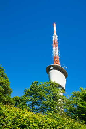 TV Tower on Blue Sky Green Trees Sunny Summer Wireless Communication Technology Engineering Architectureのeditorial素材