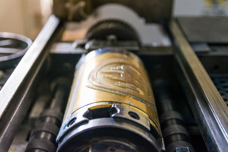 Golden Letterpress Cylinders Rustic Vintage Printing Method Metallic Rollers Four Color CMYK Print Closeup Machine Industrial Equipmentの写真素材