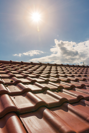 European Brand New Orange Clay Roof Tiles Sunshine Outside Daytime Houseの写真素材