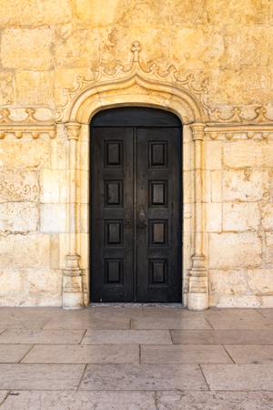 Medieval Portuguese Door Black Closeup Architectural Feature Warm Temperatureの写真素材