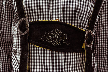 Traditional German Lederhosen Center Chestpiece Closeup Leather Plaid Dress Black Whiteの写真素材