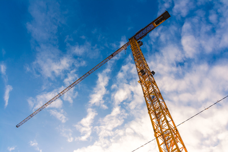 Yellow Construction Crane Closeup Bottom Equipment Outdoors Blue Sky Sunsetの写真素材