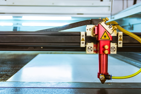 Laser Cutting Machine Thin Materials Cut Head Beam Idle Open Inside Red Body Metal Engineering Industrial Professional Production Sheetの写真素材