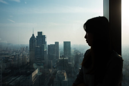 CHINA-JUNE,2018:A Chinese Girl Looking at the View from a Windowのeditorial素材