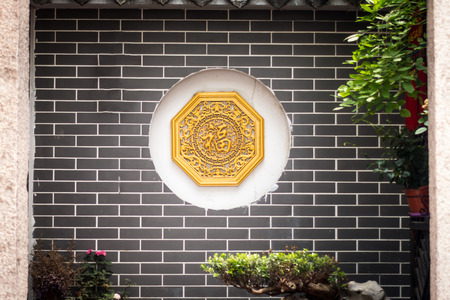A Chinese Traditional Screen Wall Facing the Gate of a Houseの写真素材