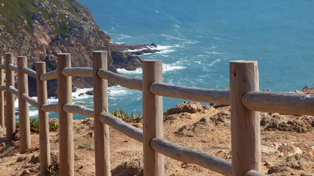 Wooden Posts Along Beach Cliffside Ocean Walking Alongの写真素材