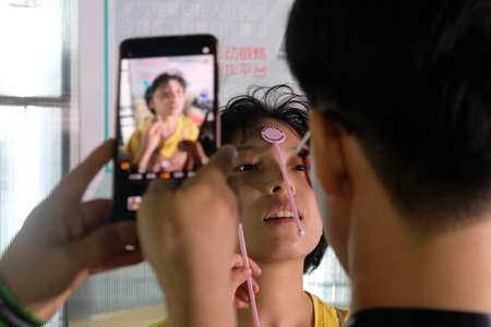 SHANGHAI, CHINA: July 2018: A new medical app being developed in China is being tested on a female patientのeditorial素材
