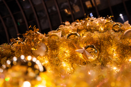 Closeup decorated gold and yellow Christmas tree for celerating seasonの写真素材