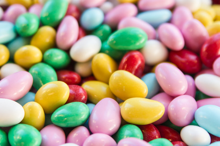 Background image of sweet jordan almonds or chocolate buttons の写真素材