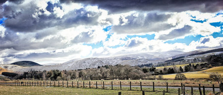 Snow dusted Caidmuir Hill, Lyne, Peebles, Scotlandの写真素材