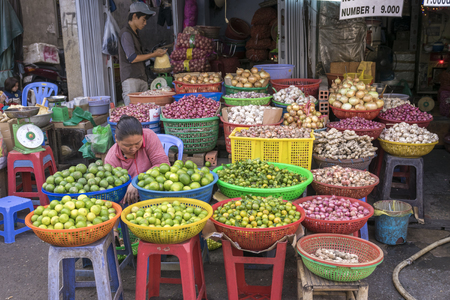 HO CHI MINH CITY, VIETNAM - MAR 1: A vegetables and fruit shop on the street of HO Chi Minh City on Mar 1, 2014. Market on the street are an indigenous culture in Vietnamのeditorial素材