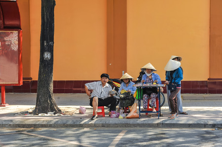 HO CHI MINH CITY, VIETNAM - FEB 10: Lottery ticket sellers on the walkway in Ho Chi Minh City on Feb 10, 2010.のeditorial素材