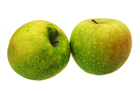 Green apple on whiteの写真素材