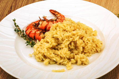 Italian trditional Risotto with tiger prawn and thymeの写真素材