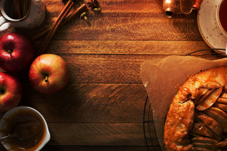 Apple and salted caramel rustic galette, free form pie overhead shot with copy spaceの写真素材