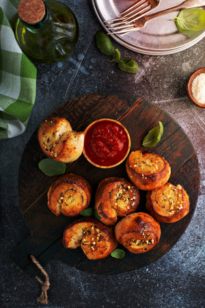 Garlic dinner rolls with marinara dipping sauceの写真素材
