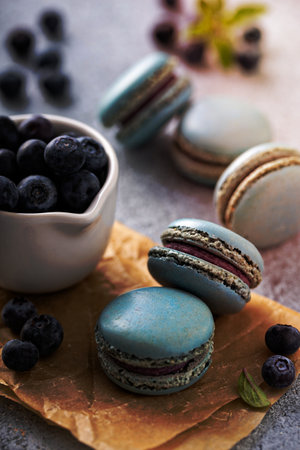 Blueberry macarons with fresh berries on the tableの写真素材