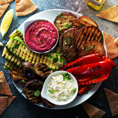 Grilled vegetables and hummus platter with feta cheeseの写真素材