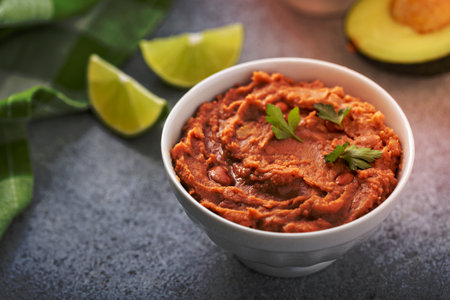Refried beans in a white bowl, mexican dishの写真素材