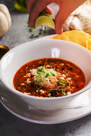 Chili served with crumbled cheese and crispy tortillaの写真素材